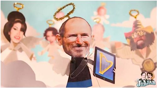 Screenshot of the jibjab Steve Jobs parody. Jobs is portrayed with halo, clouds behind him, holding an iPad with an image of a harp on it.