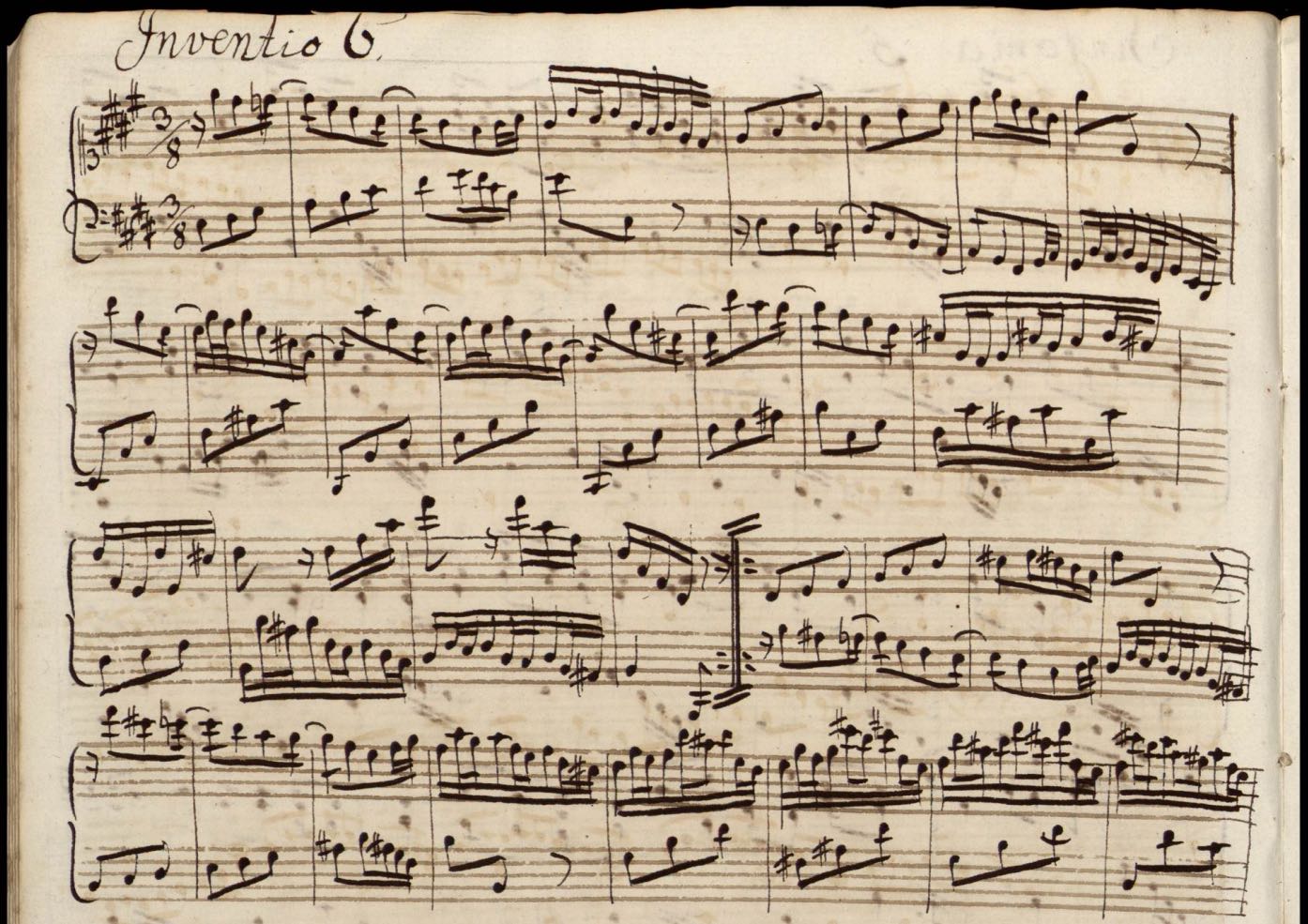 A photo of sheet music for Bach's Invention #6.