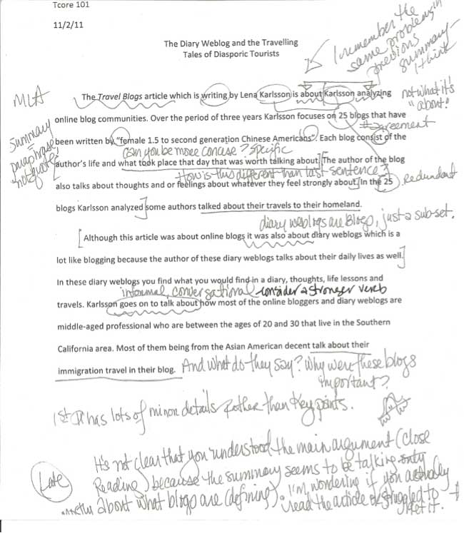 Image of a student paper with many teacher comments.