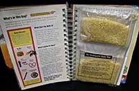 open pages of the Earthsearch book. A tradition page is seen on the left of the book, but the right page is a ziplock bag of grain.